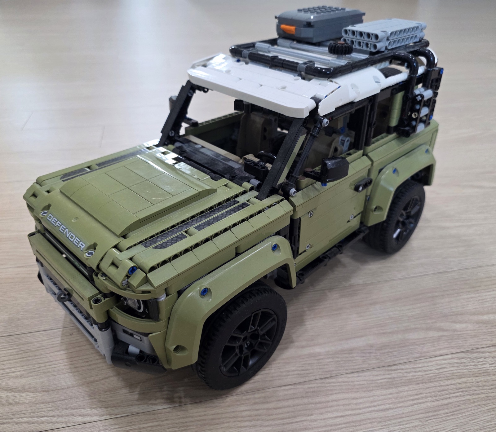 Photographed olive brick-built off-road 4x4 reference
